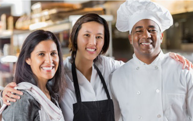 Three restaurant workers posing - Diversity
